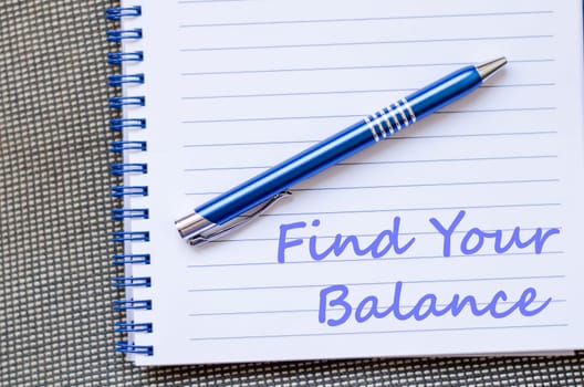 Find your balance text concept write on notebook with pen