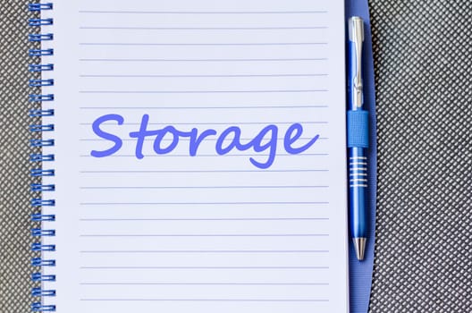 Storage text concept write on notebook with pen