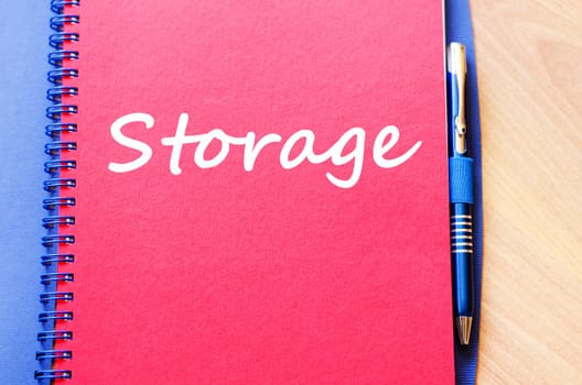 Storage text concept write on notebook with pen
