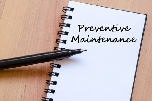 Preventive maintenance text concept write on notebook with pen