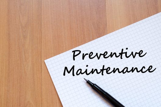 Preventive maintenance text concept write on notebook with pen