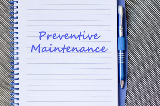 Preventive maintenance text concept write on notebook with pen