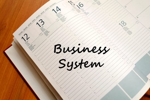 Business system text concept write on notebook