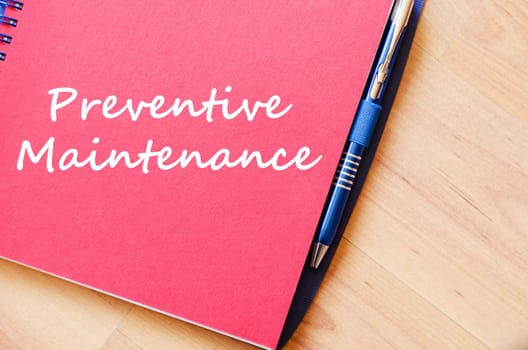 Preventive maintenance text concept write on notebook with pen