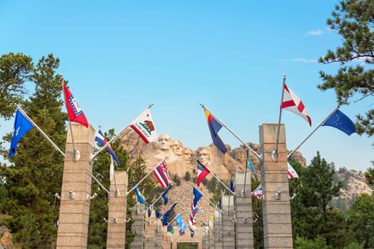 Row of state flags leading to Mount Rushmore in Keystone, South Dakota