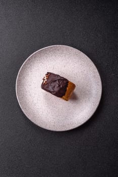 Round sweet New York roll croissant with chocolate cream filling on a dark concrete background