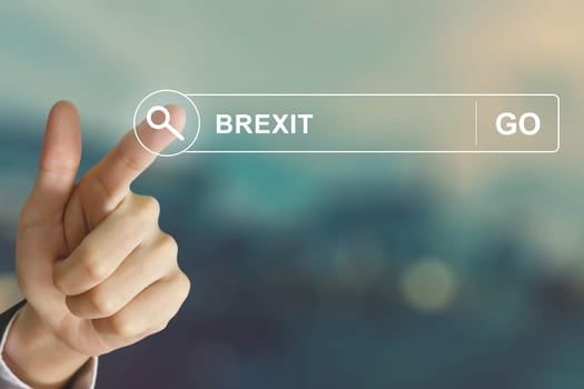 business hand clicking Brexit or British exit button on search toolbar with vintage style effect