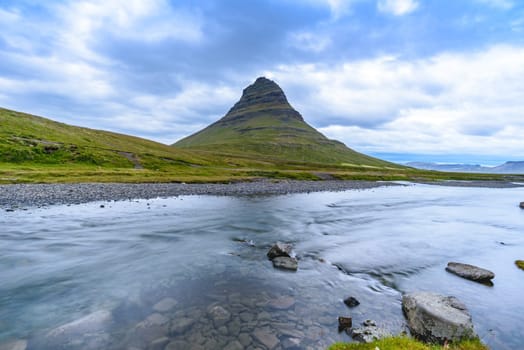 Beautiful Kirkjufell mountain with cloudy, Snaefellsnes peninsula, Iceland, selective focus
