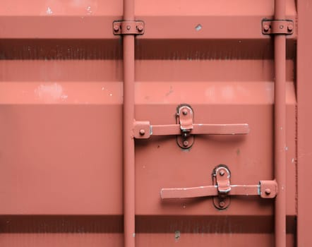 Red shipping container cargo background, close up of container back door locked