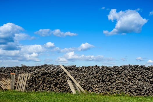 Outdoor wooden warehouse with clouds and blue sky