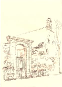 Old gate at the provincial European street. Architecture and the city. French province.