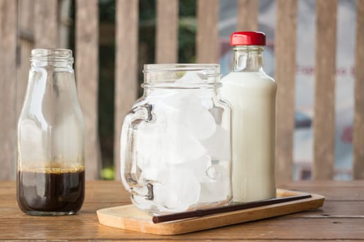 Homemade iced coffee ingredient on wooden table, stock photo