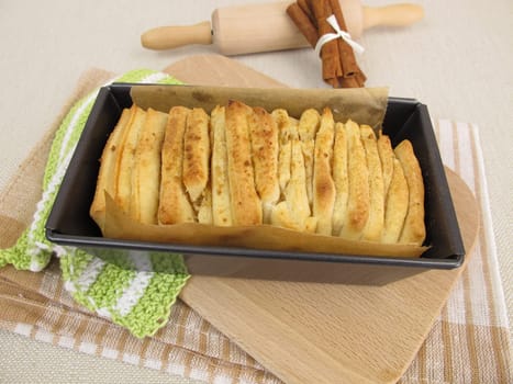 Plucked bread with cinnamon and sugar in the baking dish