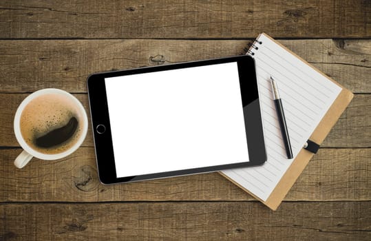 tablet on wood desk on top view