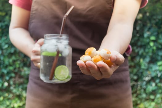 Yellow mini cakes and lime Infused detox water, stock photo
