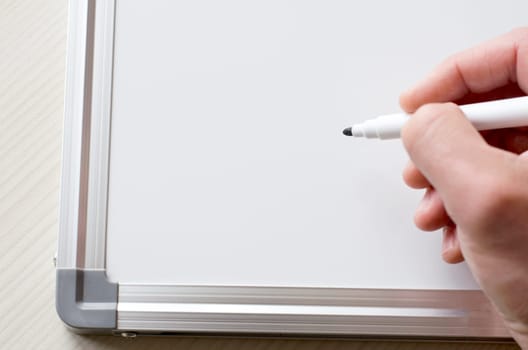 Human hand and whiteboard with place for text