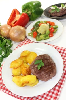 Ostrich steak with baked potatoes and peppers - Artichokes - Vegetables