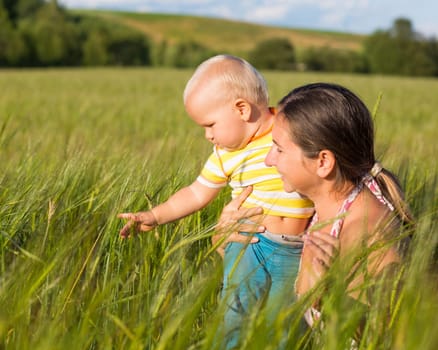 Baby and mom in wheat field