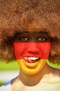 Deutschlandfan - Girl with German colors on her face