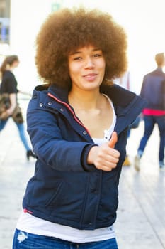 Young woman with thumbs up