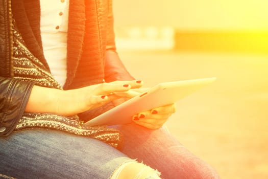 Young modern woman with tablet