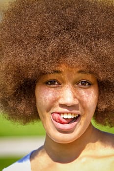 Naughty young woman with afro hairstyle