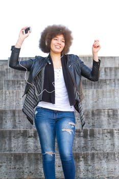 Young people listen to music and dance