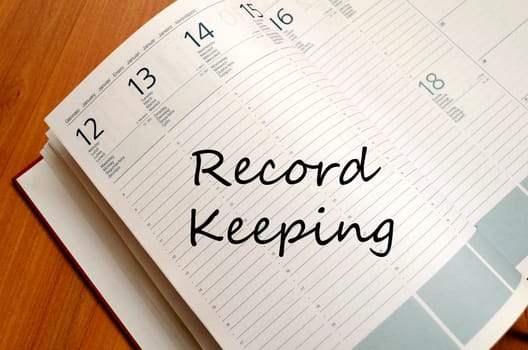 Record keeping text concept write on notebook