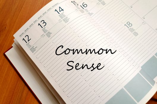 Common sense text concept write on notebook