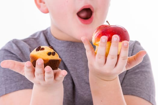 little boy with food isolated on white background - apple or a muffin