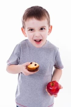 little boy with food isolated on white background - apple or a muffin