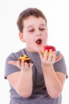 little boy with food isolated on white background - apple or a muffin