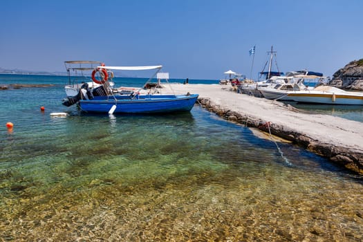 Old traditional beautiful fishing boats by the sea in Rhodes island in Greece
