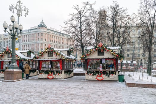 Moscow, Russia - January 05, 2016: Elegant houses with Christmas decorations on a snowy winter street
