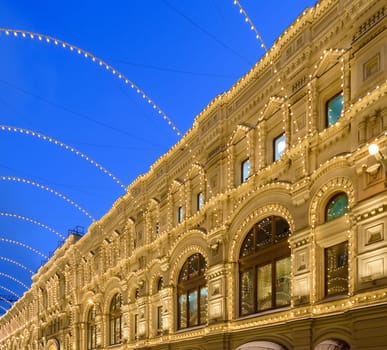 Night illumination of the building, an ornate lots of glowing light bulbs.