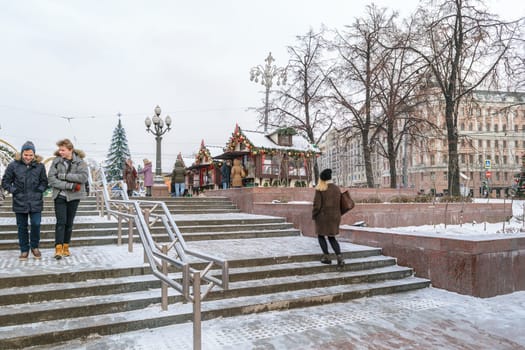 Moscow, Russia - January 05, 2016: People on the snow-covered stairs near Pushkin Square in the New Year on winter