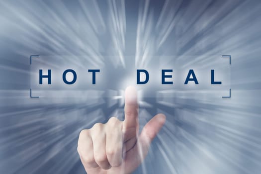 hand clicking on hot deal button with zoom effect background