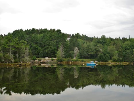 Landscape showing a quiet and peaceful lake with reflections