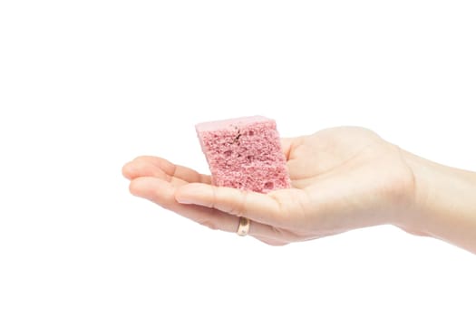 Woman's hand holding steamed cake on white background