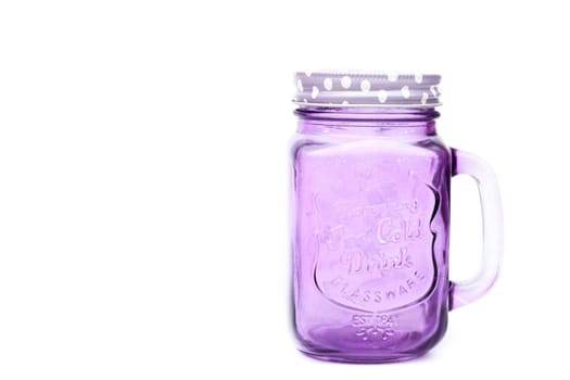 Violet mason glass on white background, stock photo