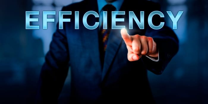 Male industrial manager pushing the capitalized word EFFICIENCY on a touch screen interface. Business concept for the ability to do things well, while minimizing waste of time, energy or resources.