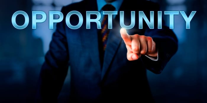 Male entrepreneur pressing OPPORTUNITY on a touch screen interface. Business concept for a market, career or business opportunity. Plenty of copy space across dark suit and blurred office interior.