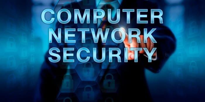 Administrator touching COMPUTER NETWORK SECURITY onscreen. Business metaphor and technology concept for secure computing in a network. Closed virtual padlocks refer to privacy and protection of data.