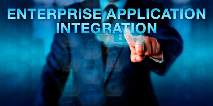 Software engineer touching ENTERPRISE APPLICATION INTEGRATION on a screen. Business model and information technology concept for integration of applications and automation of business processes.