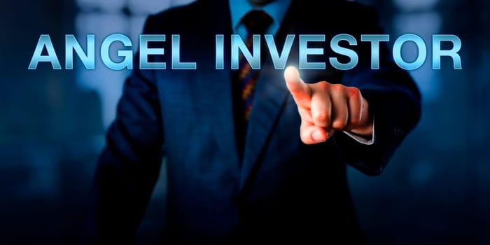 Entrepreneur is pointing at ANGEL INVESTOR on a virtual screen. Financial metaphor and business concept for the patron role of a venture capitalist exchanging funding for private ownership equity.
