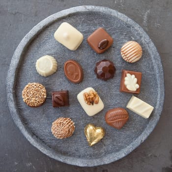 Selection of different chocolates with tender and milk chocolate