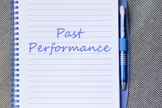 Past performance text concept write on notebook with pen