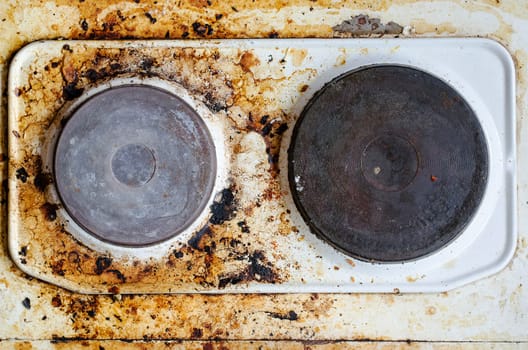 Very dirty hot plate in the kitchen