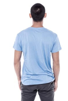 Back pose of young man facing the wall