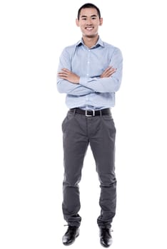 Full length image of smart guy with crossed arms